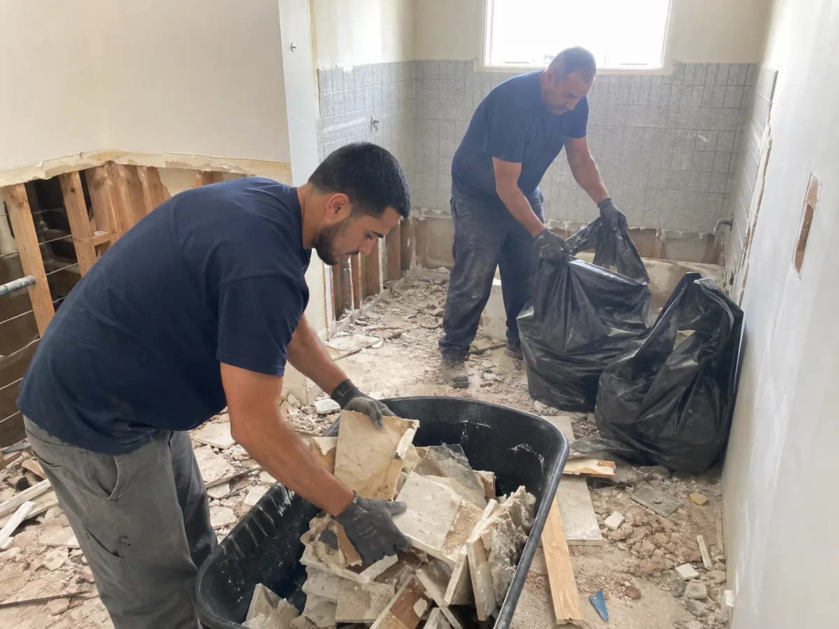 Bathroom demolition debris — tile and fixtures — removed in Oakland
