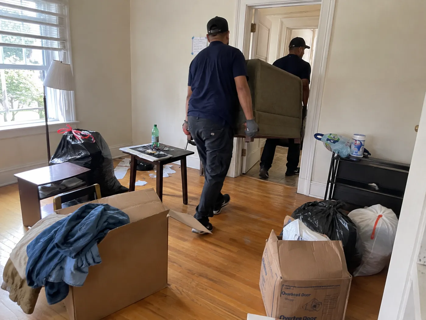 Crew clearing a unit after a tenant moved out in Oakland